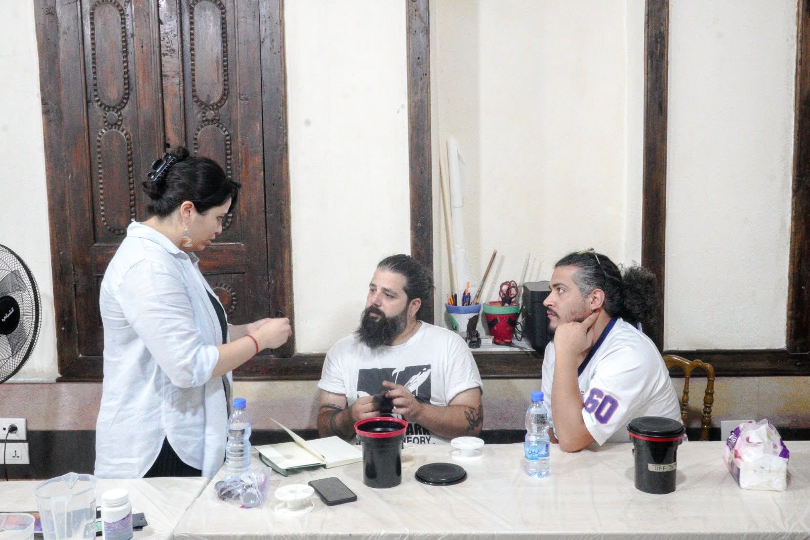 Film developing workshop discussion around the table, Damascus, September 2026